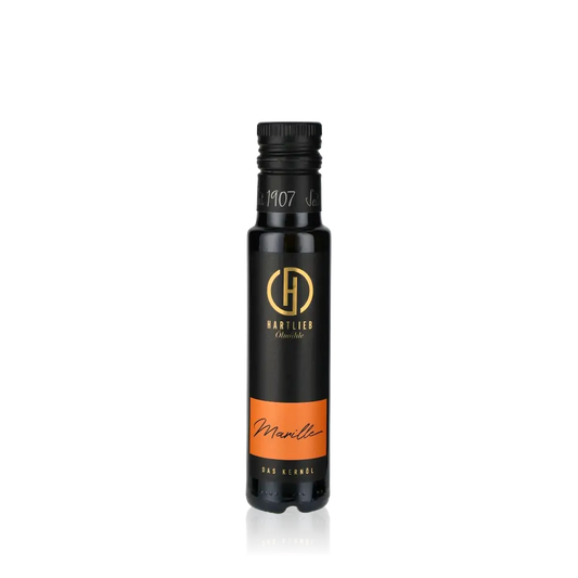 Hartlieb Marillenöl Flasche vor schwarzem Hintergrund.