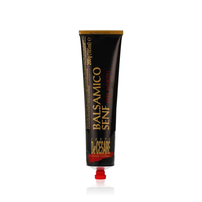 Conte DeCesare Balsamicosenf Tube auf schwarzem Hintergrund.