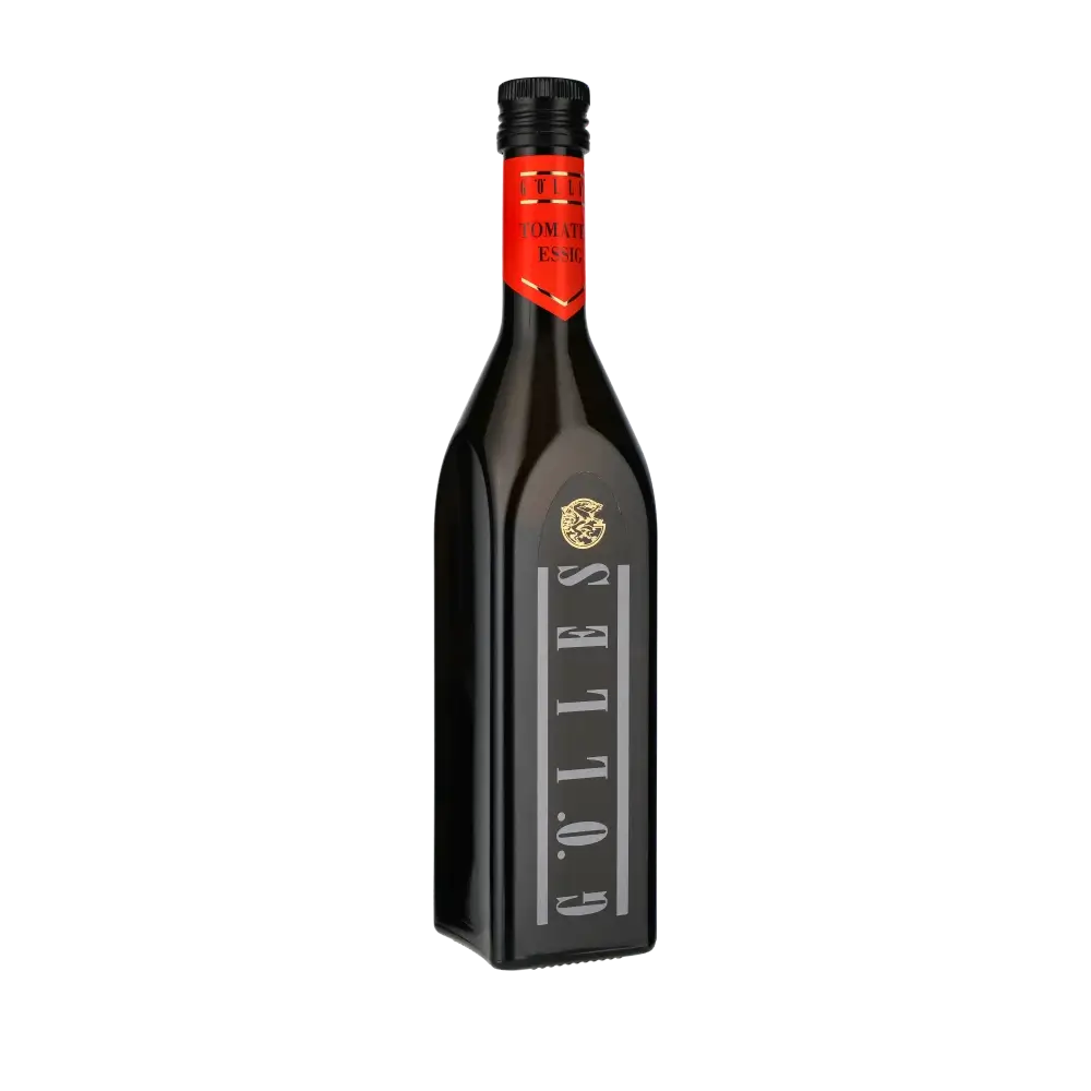 Gölles Tomatenessig Flasche auf schwarzem Hintergrund.