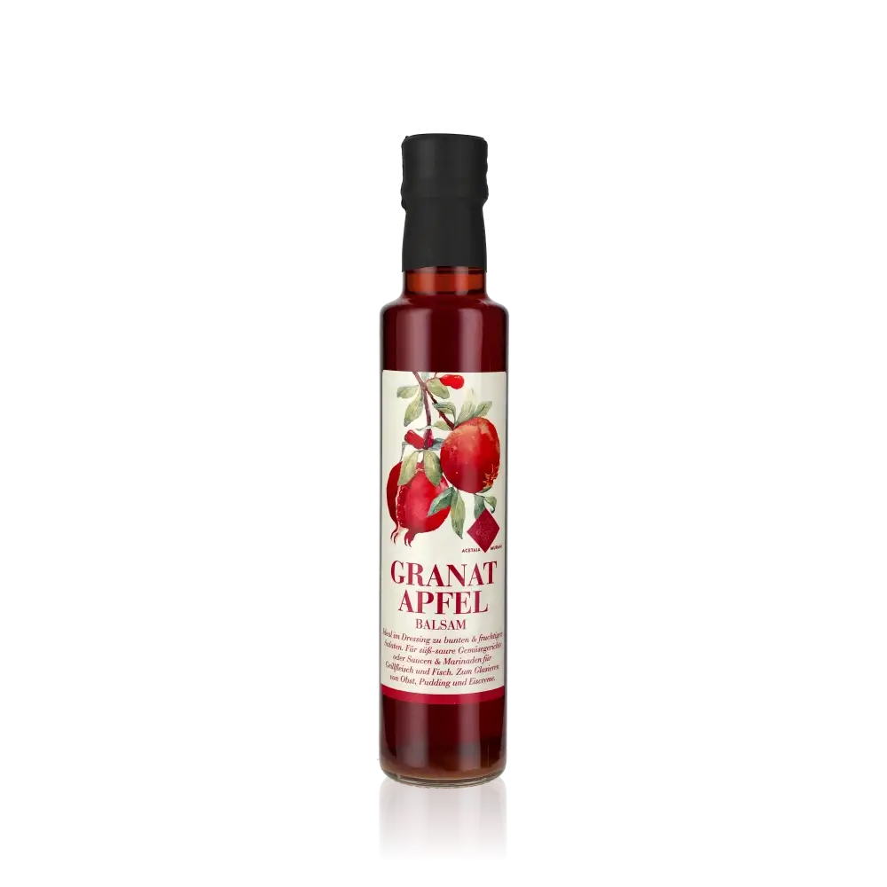 Murani Granatapfel Balsamessig Flasche auf schwarzem Hintergrund.