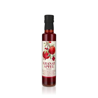 Murani Granatapfel Balsamessig Flasche auf schwarzem Hintergrund.
