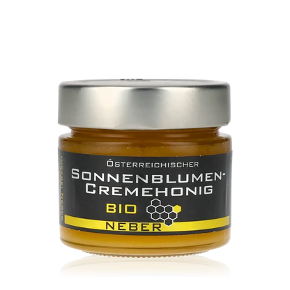 Neber Bio Sonnenblumencremehonig Glas mit schwarzem Etikett.