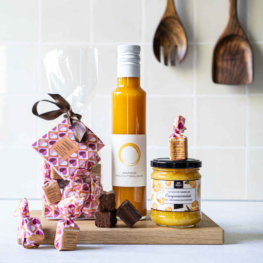 Geschenkset mit Mangobalsam, Trüffelpralinen mit Orange und Orangenmarmelade
